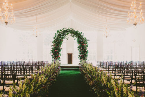 Greenery Arch and Aisle in a White Tent | Legendary Events